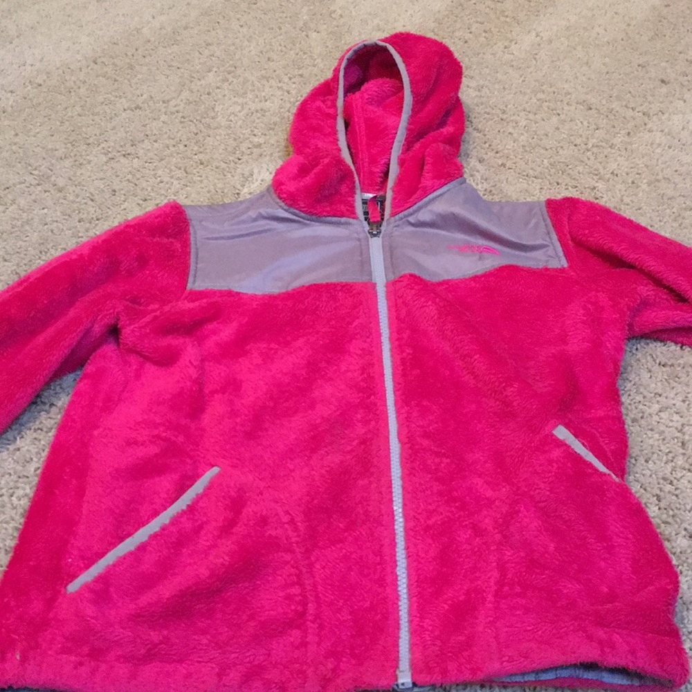 A pink fuzzy North Face jacket